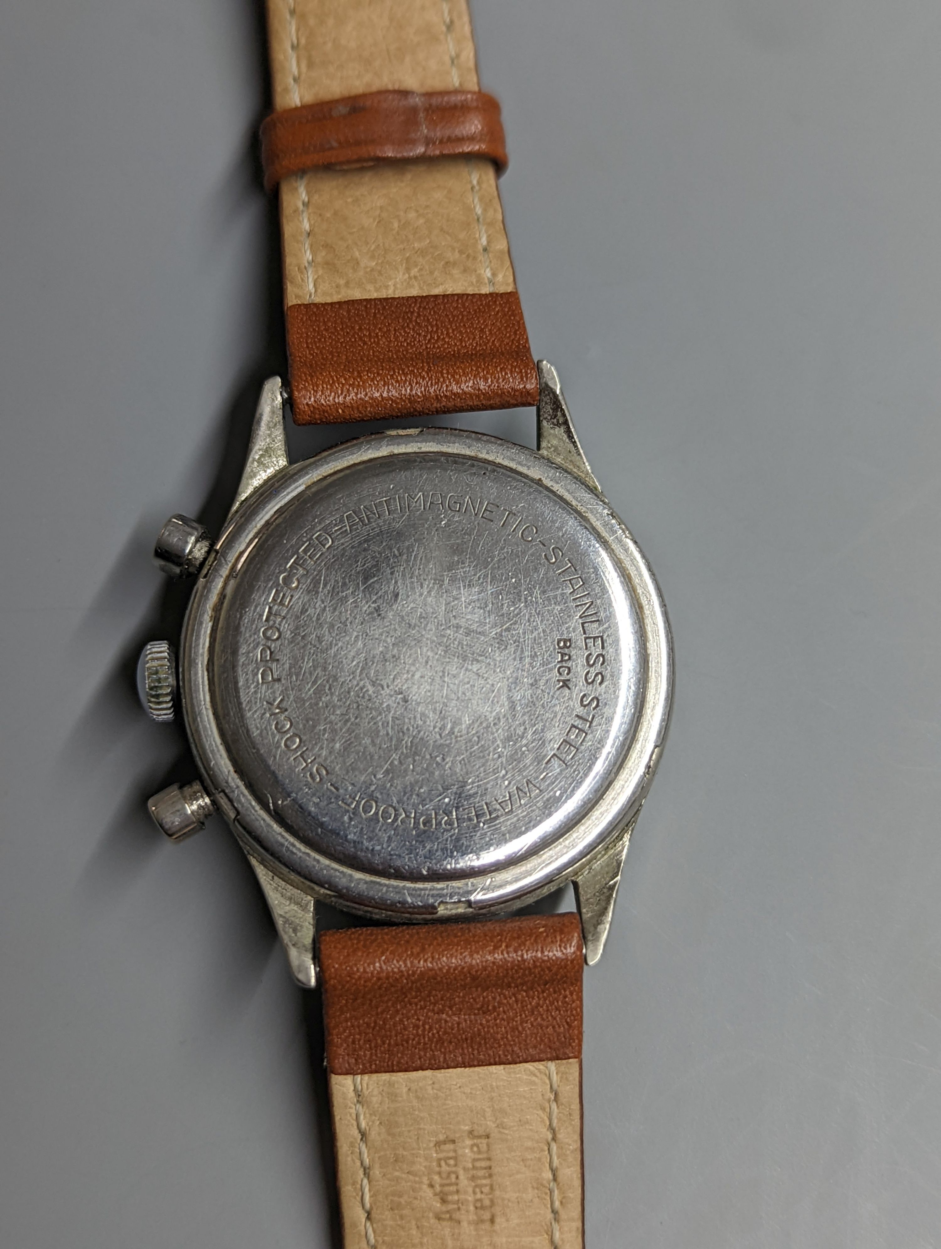 A gentleman's stainless steel Baume & Mercier Chronographe wrist watch, with Arabic numerals and two subsidiary dials, case diameter 35mm, on a later associated leather strap.